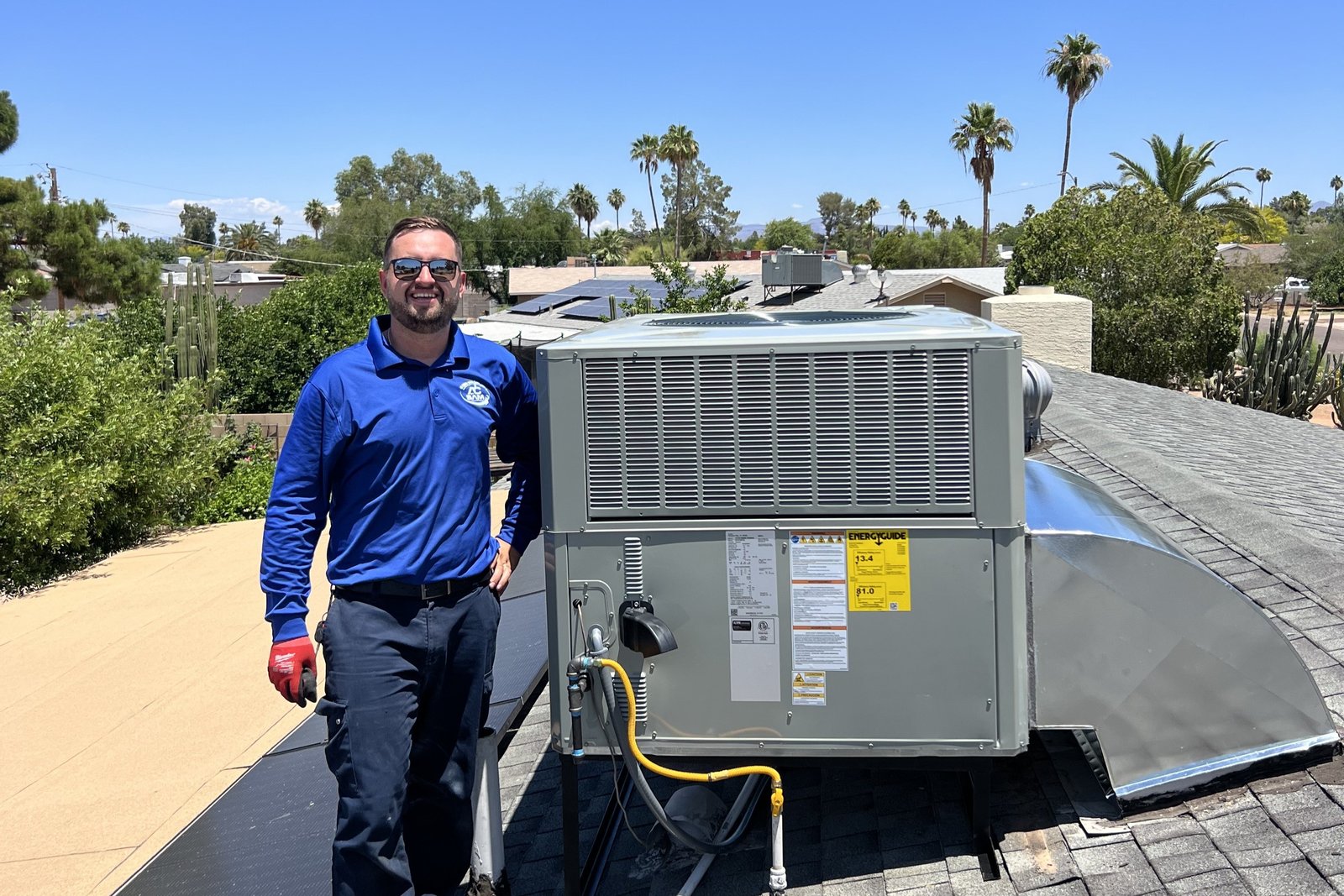 AC by Sam LLC owner performing HVAC service on a Phoenix rooftop.